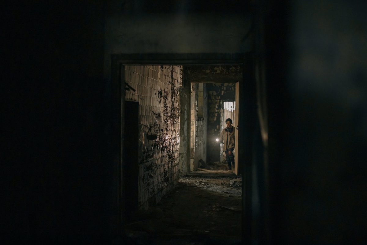 brown wooden door in a dark room