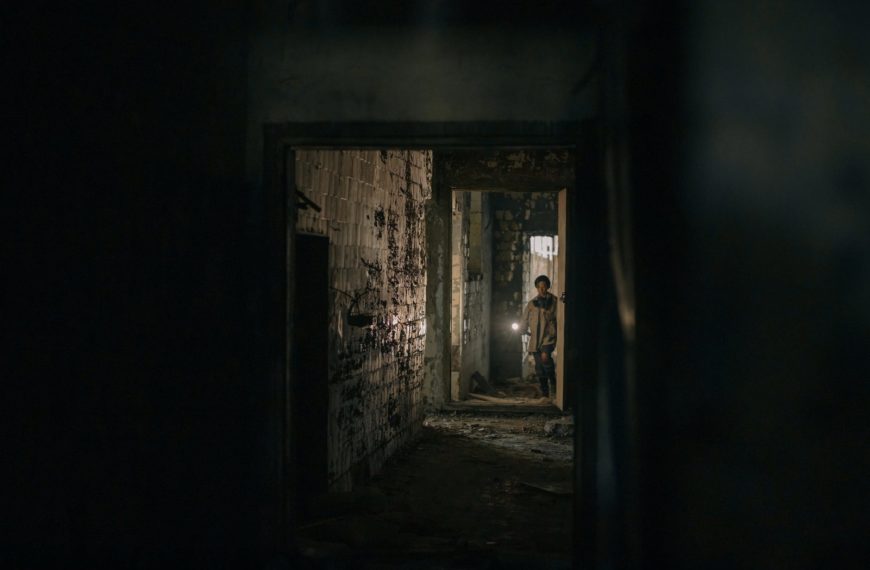 brown wooden door in a dark room